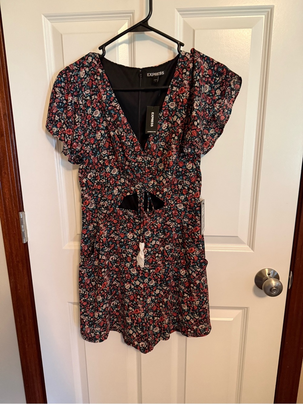 Express Black Floral V-Neck Romper with Red and Teal Accents